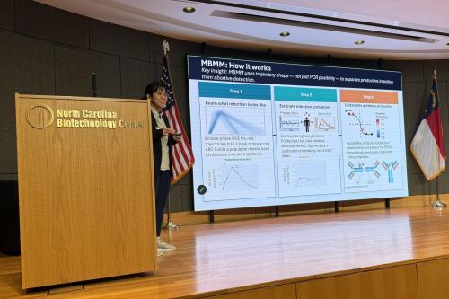 Linh Do presenting scientific poster.
